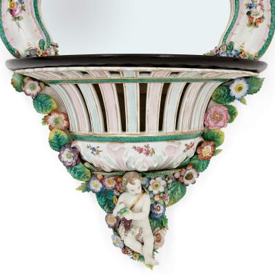  Meissen Porcelain Manufactory Pair of Meissen style porcelain and ebonised wood mirrored wall brackets