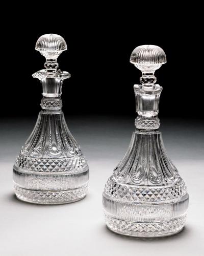  PERRIN GEDDES AN ELABORATELY CUT PAIR OF REGENCY SEMI SHIPS DECANTERS BY PERRIN GEDDES