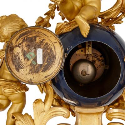  Popon A Paris Large cherub themed gilt bronze clock garniture by Popon