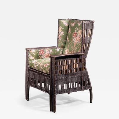  Prag Rudniker Woven wicker chair with floral motif upholstery Austria