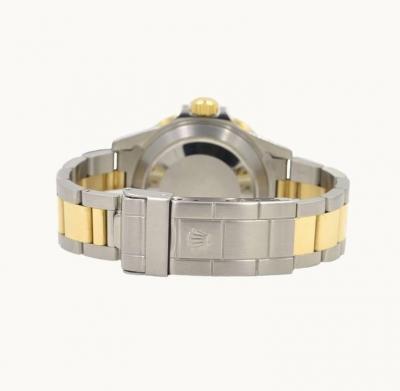  Rolex Watch Co Rolex Two Tone Submariner Wristwatch in 18K Gold and Steel Ref 16803 Circa 1985