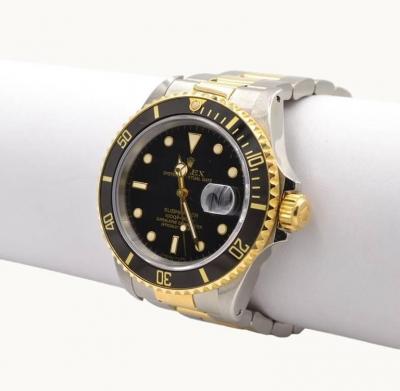 Rolex Watch Co Rolex Two Tone Submariner Wristwatch in 18K Gold and Steel Ref 16803 Circa 1985
