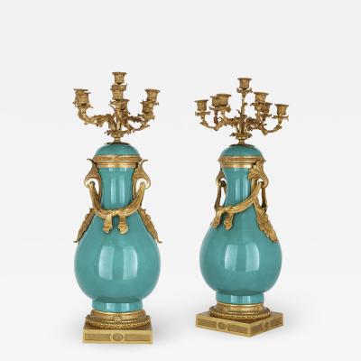  S vres Porcelain Manufactory Pair of gilt bronze and turquoise porcelain candelabra