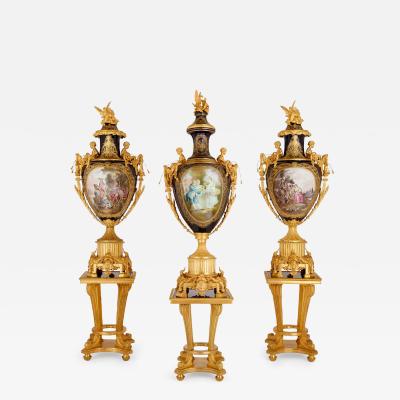  S vres Porcelain Manufactory Set of three large S vres style porcelain vases with gilt bronze pedestals