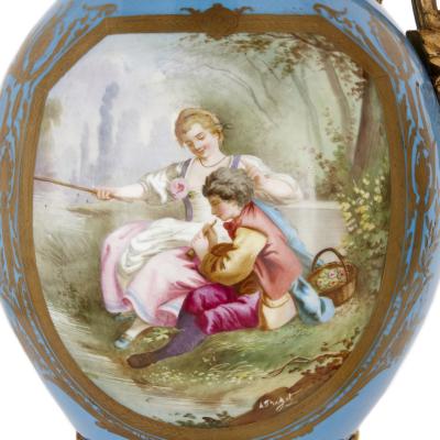  S vres Porcelain Manufactory Two large Rococo style porcelain and gilt bronze jugs