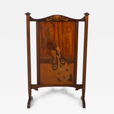  Shapland Petter Shapland Petter An Arts Crafts Firescreen with a Beautiful Peacock Inlaid