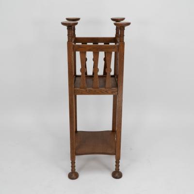  Shapland Petter Shapland Petter Arts Crafts oak plantstand with Voysey style disc finials 