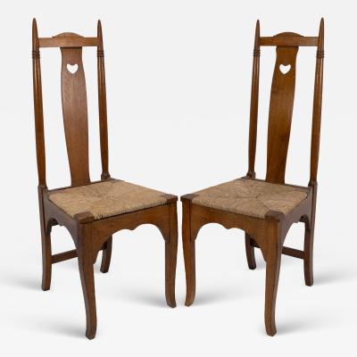  Shapland Petter Shapland Petter a Pair of Arts Crafts Oak Dining Chairs with Pierced Hearts