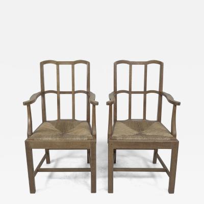  Sir Ambrose Heal Pair of Cotswold School Arts Crafts Oak Lattice Back Armchairs with rush Seats