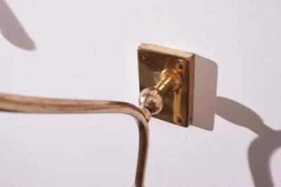  Stilnovo A pair of wall light made of brass and painted metal Italy 1950s