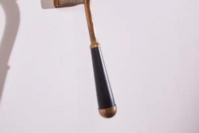  Stilnovo A pair of wall light made of brass and painted metal Italy 1950s