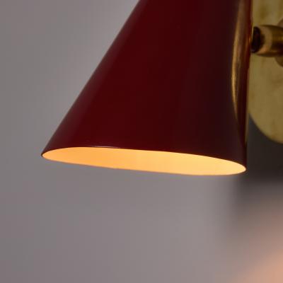  Stilnovo Pair of 1960s Stilnovo Perforated Red Metal and Brass Articulating Sconces