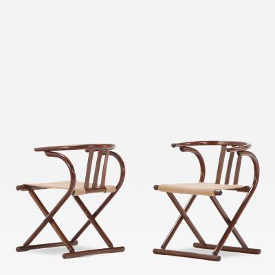  Thonet A pair of Thonet style folding sling chairs having downswept arms 