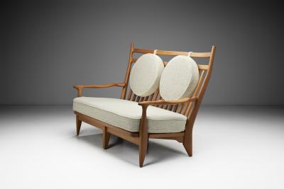  Votre Maison Guillerme et Chambron Two Seater Oak Sofa for Votre Maison France 1960s