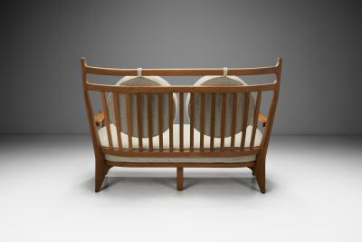  Votre Maison Guillerme et Chambron Two Seater Oak Sofa for Votre Maison France 1960s