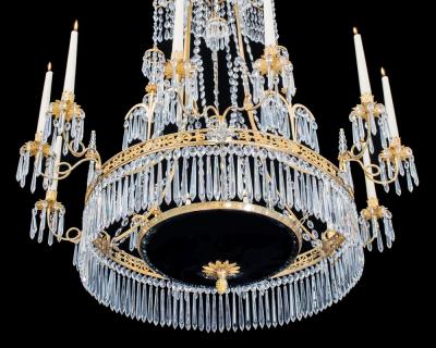  Werner Mieth A GERMAN NEOCLASSICAL SILVER AND GILT BRONZE TWELVE LIGHT CRYSTAL CHANDELIER