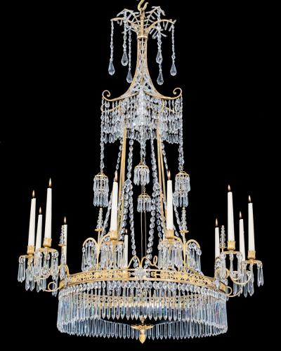  Werner Mieth A GERMAN NEOCLASSICAL SILVER AND GILT BRONZE TWELVE LIGHT CRYSTAL CHANDELIER