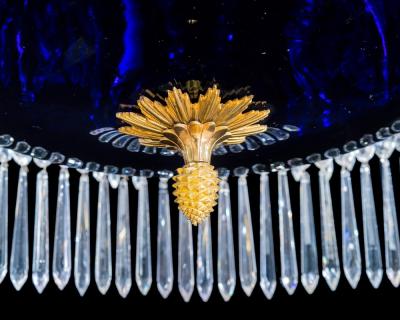  Werner Mieth A GERMAN NEOCLASSICAL SILVER AND GILT BRONZE TWELVE LIGHT CRYSTAL CHANDELIER