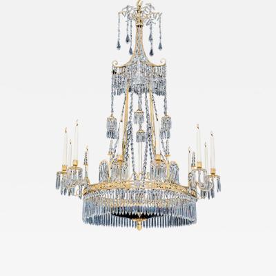  Werner Mieth A GERMAN NEOCLASSICAL SILVER AND GILT BRONZE TWELVE LIGHT CRYSTAL CHANDELIER