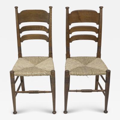  William Birch Ltd Liberty Co A Pair of William Birch Arts Crafts Oak Rush Seat Dining Chairs