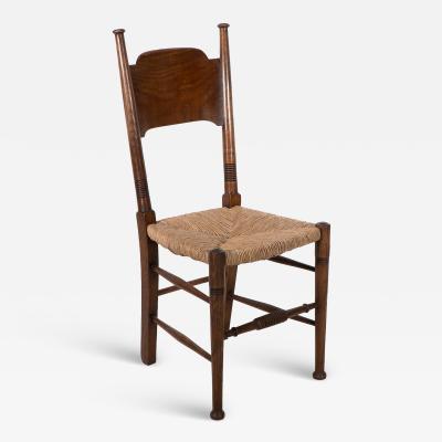  William Birch Ltd William Birch Liberty Co A Arts and Crafts rush seat oak dining chair