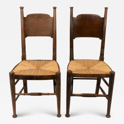  William Birch Ltd William Birch retailed by Liberty Co Pair of Arts Crafts oak dining chairs