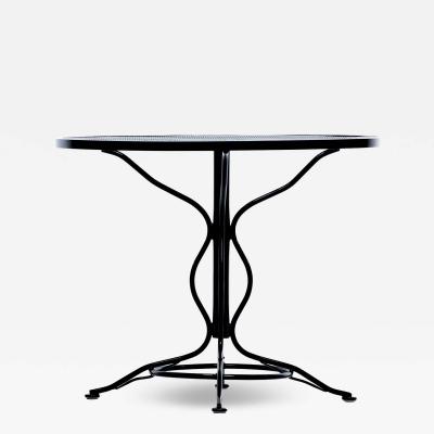  Woodard Furniture Co Mid Century Modern Black Wrought Iron Table with Sculptural Base and Footrests