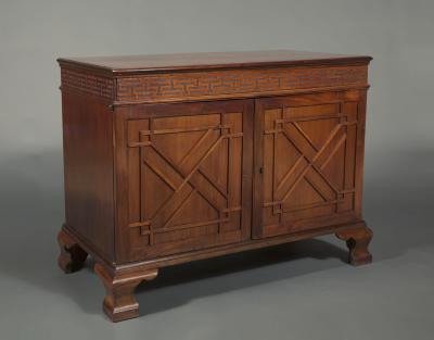 Wright Elwick A GEORGE III MAHOGANY BLIND FRETTED TWO DOOR LIBRARY OR ESTATE CABINET
