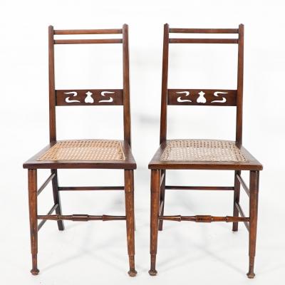  Wylie Lochhead A Pair of Arts Crafts Side Chairs with Stylized Tulip Cut outs to the Back