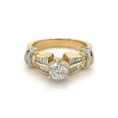 0 70 Carat Round Diamond Ring with Baguette Cut Diamond Side Stones in 14k gold