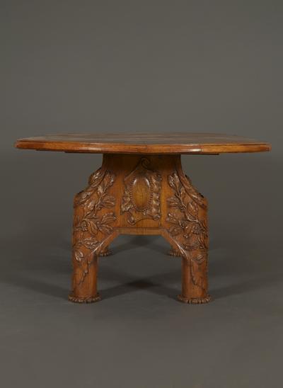 11140 AN INTERESTING CARVED OAK ARTS AND CRAFTS PERIOD LIBRARY OR CENTER TABLE