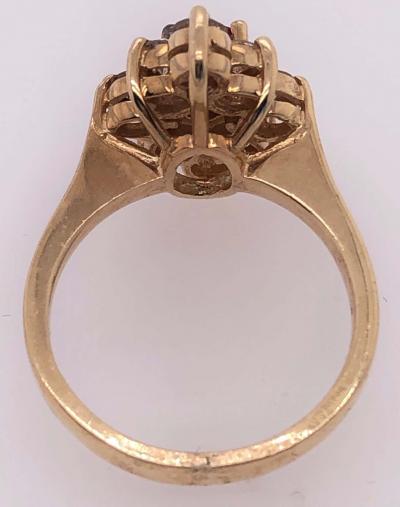 14 Karat Yellow Gold Ruby Center Framed In Diamonds Ring