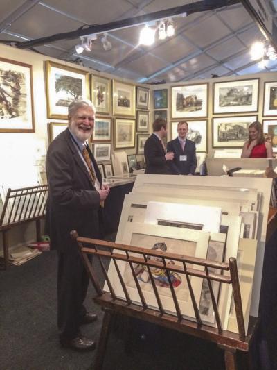 Donald Cresswell, in the foreground, and his son, Jonathan (right, in back corner), of the Philadelphia Print Shop.