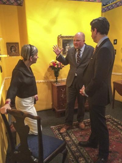 Exhibitor Elle Shushan speaks with Adam Erby, Director of Historic Preservation at Mount Vernon (center), and friend.