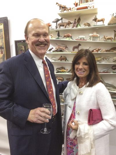 Bruce Perkins of Flather & Perkins, and his wife Pam (in front of a circus menagerie offered by Stephen Powers).