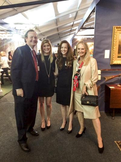 Taylor Thistlethwait with friends, in front of his booth.