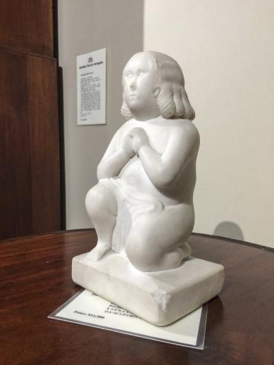 This carved marble diminutive figure of a praying woman sold within minutes of the show