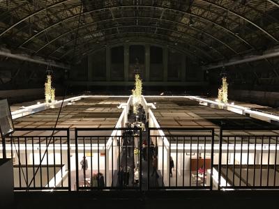 Looking down to booths and hanging flower arrangements on 1st floor. 