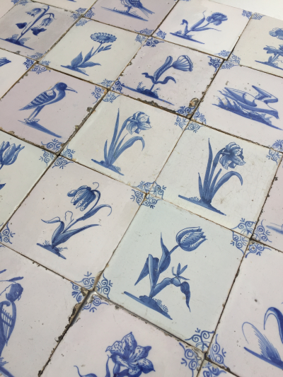 17th century Dutch Delft tiles with flowers and birds backsplash bathroom