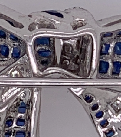 18 Karat White Gold Sapphire and Diamond Bow Pin 1 10 TDW
