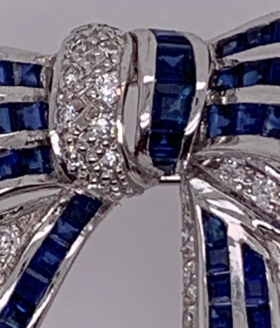 18 Karat White Gold Sapphire and Diamond Bow Pin 1 10 TDW