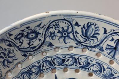 18th CENTURY SPANISH OR PORTUGUESE FAIENCE TWO HANDLED COLANDER