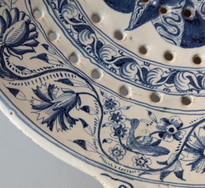18th CENTURY SPANISH OR PORTUGUESE FAIENCE TWO HANDLED COLANDER