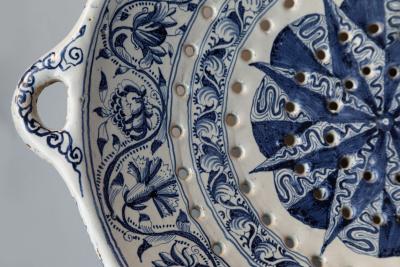 18th CENTURY SPANISH OR PORTUGUESE FAIENCE TWO HANDLED COLANDER