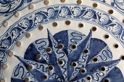 18th CENTURY SPANISH OR PORTUGUESE FAIENCE TWO HANDLED COLANDER