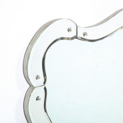 1940s Hollywood Sculptural Beveled Wall Mirror with Stylized Shield Cartouche