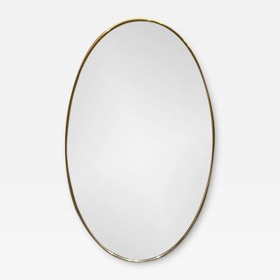 1950S OVAL MIRROR IN AGED BRASS IN THE STYLE OF GIO PONTI