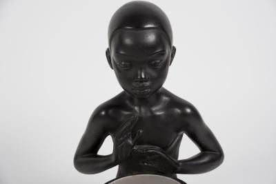 1950s Ceramic lamp showing a little African playing Tom tom signed A Carli