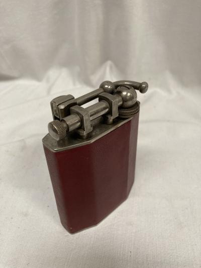1950s vintage table lighter in leather with a crown emblem