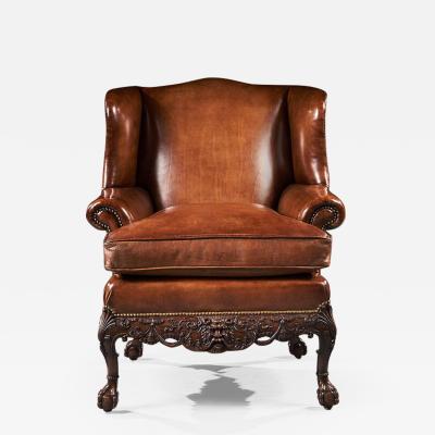 19TH C MAHOGANY LEATHER UPHOLSTERED WINGBACK ARMCHAIR IN THE GEORGE II MANNER